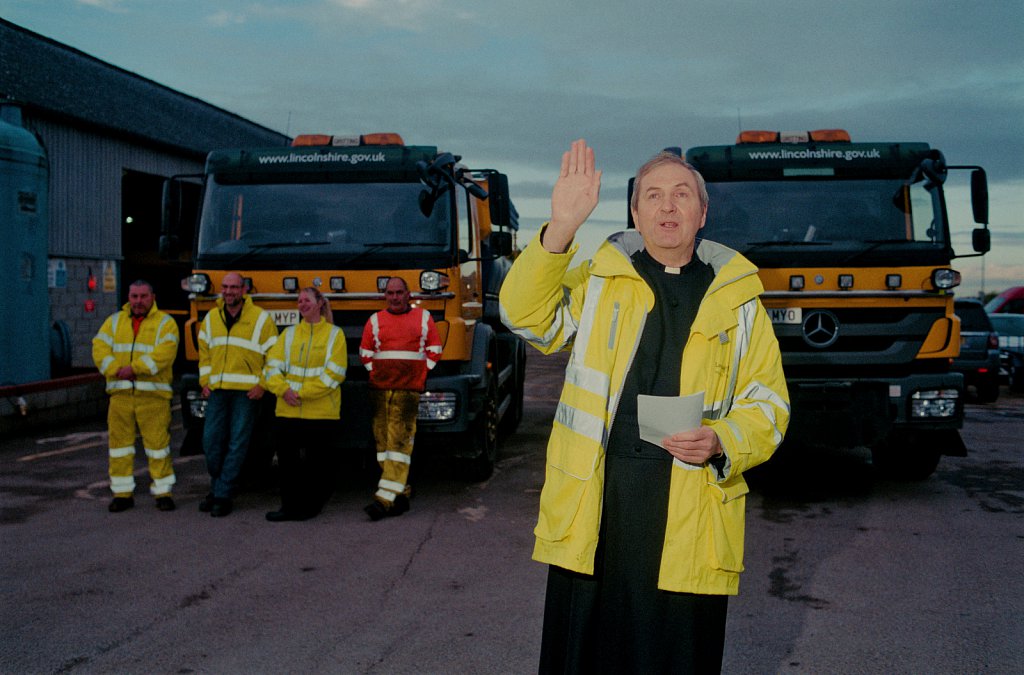 The Reverend Ian Cuthbertson blessing the Council gritters at Pode Hole, Lincs